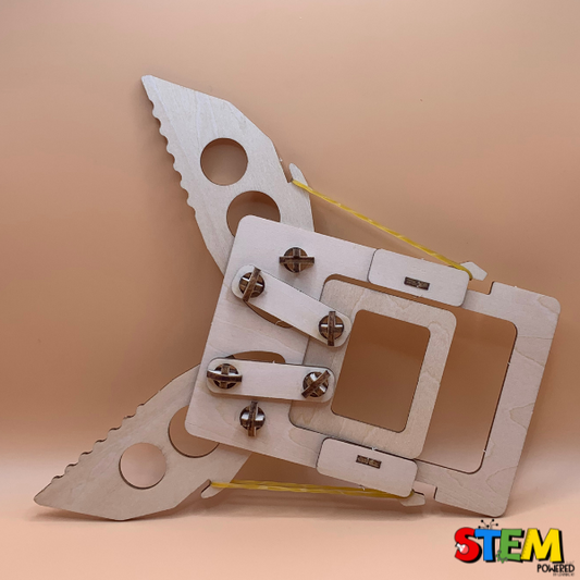 Side view of the STEM Grabber Kit, displaying its mechanical functionality and sturdy, reusable wooden materials, designed to teach kids engineering concepts.