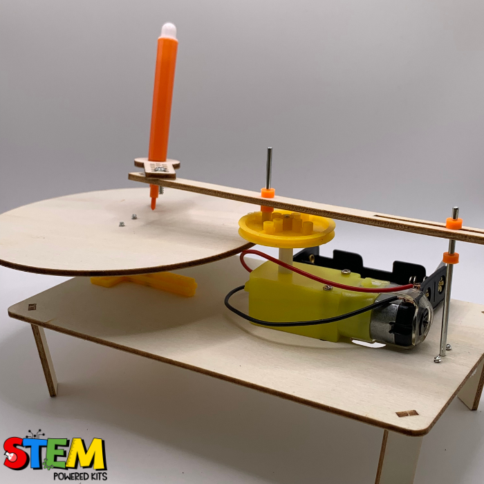 Side view of the Electric Doodle Spinner STEM Kit, showing the motorized mechanism, rotating platform, and pen holder for automated drawing.