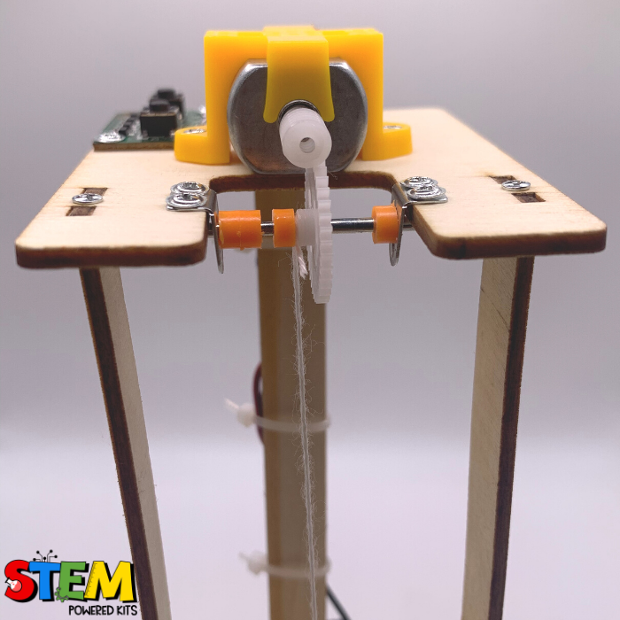 Close-up view of the pulley mechanism and motor on the Electric Elevator STEM Kit, highlighting the engineering and functionality.