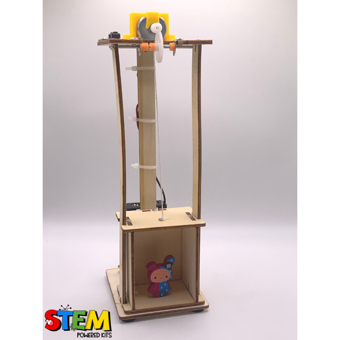 Side view of the Electric Elevator STEM Kit, showing the moving elevator platform with a small toy inside and the pulley system in action.