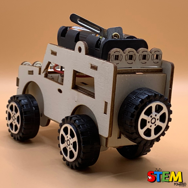 Back-side view of the assembled Electric Wired Jeep STEM Kit, highlighting the wooden chassis, motorized wiring, and sturdy tires.