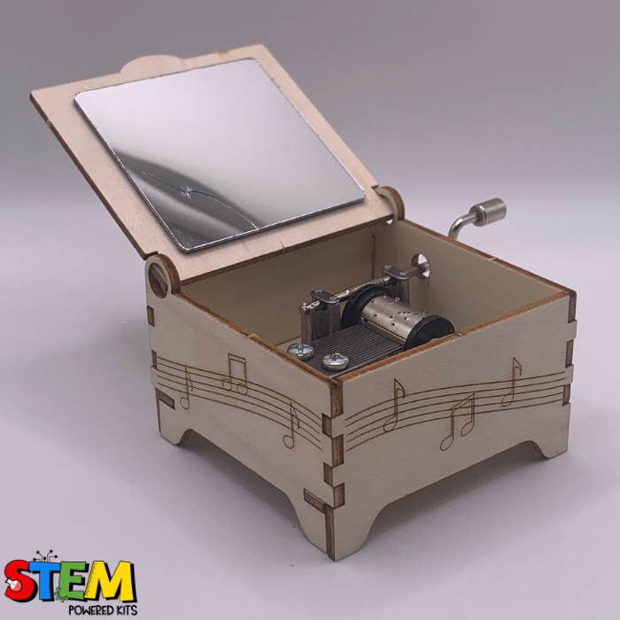 Interior view of the Hand Crank Music Box showing the mechanical components, mirror, and functional crank mechanism for playing tunes.