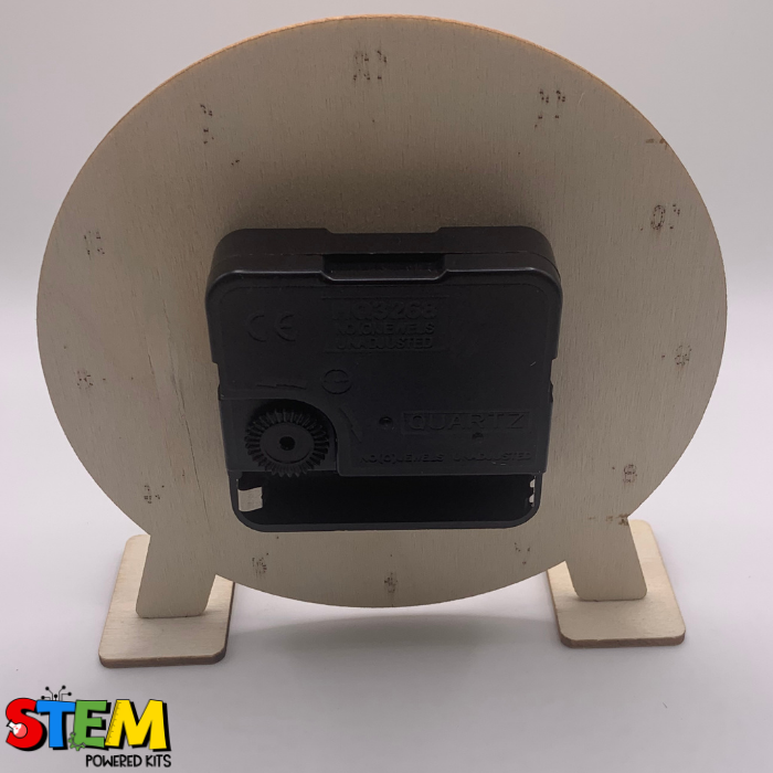 Back view of the My Little Clock STEM Kit, displaying the sturdy wooden frame and quartz movement mechanism, crafted for durability and educational value.