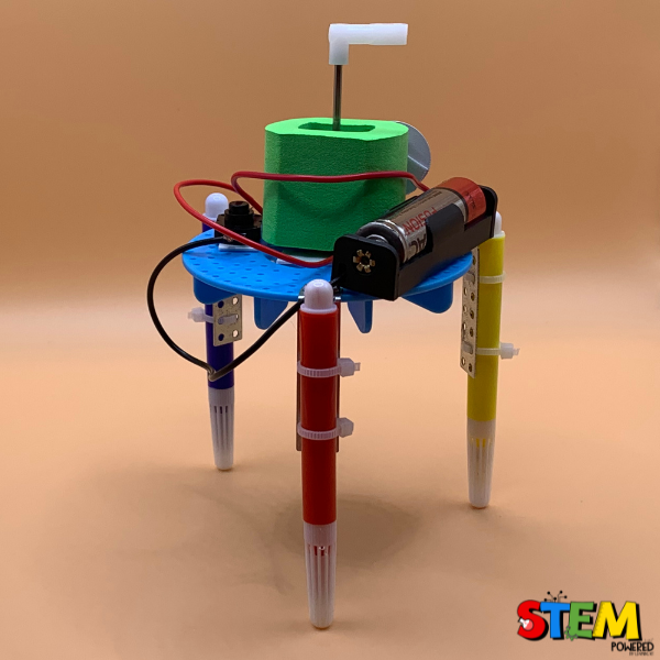 Front view of the plastic Graffiti Robot, complete with a fun design, motorized components, and colorful markers ready for creative STEM experiments.