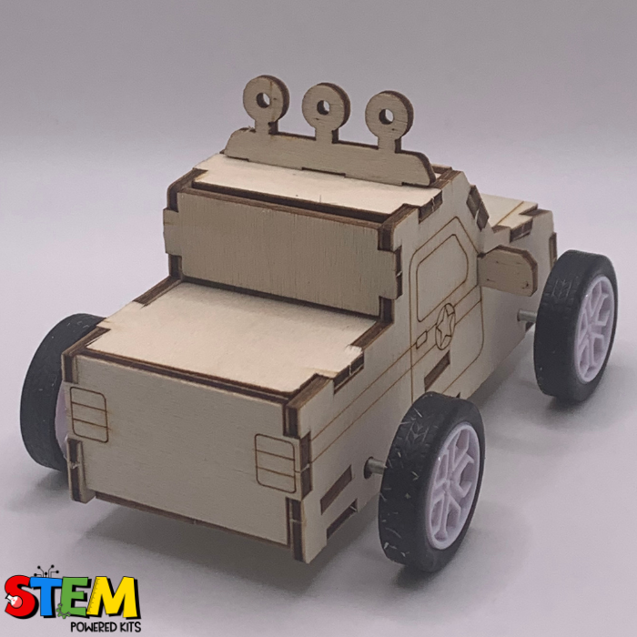 Side and back view of the assembled Pull-Back Race Car STEM Kit, featuring intricate wood detailing, sturdy construction, and motion-ready tires.