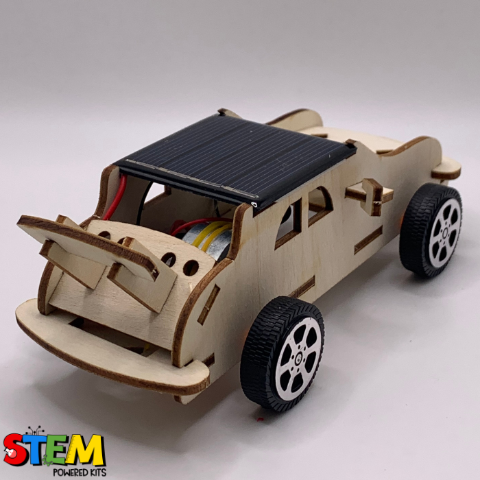 Back view of the Solar Powered Race Car STEM Kit, highlighting the solar panel, wooden spoiler, and rear wheel details for hands-on exploration of renewable energy and engineering.