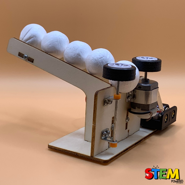 Angled side view of the Ball Pitching Machine STEM Kit, showing the pitching mechanism, wooden ramp, and motorized design for hands-on STEM exploration.