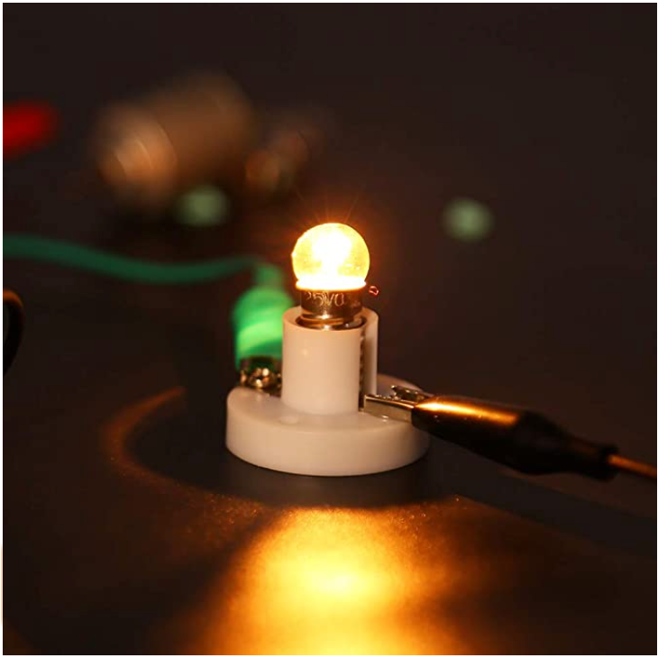 Close-up of a glowing light bulb connected to the Electric Circuit Kit, demonstrating how kids can learn about electric wiring and circuits through hands-on STEM projects.